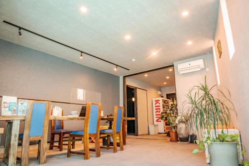 a dining room with a table and chairs at XYZ Private Spa and Seaside Resort in Shirahama