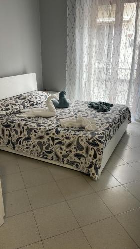 a bed with two swans on it in a room at Ninni’& Nanna’ in Cetara