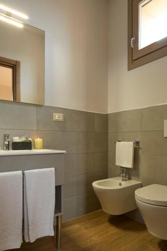 a bathroom with a toilet and a sink at Luci di Assisi B&B Wellness in Assisi