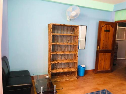 a room with a book shelf filled with records at Sara's Backpackers Hotel in Kathmandu