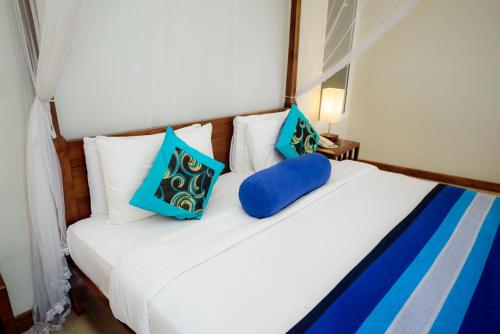 Hotel Refresh Blueにあるベッド