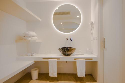 a bathroom with a sink and a mirror at Giotto Country House & Spa in Assisi