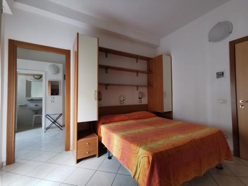 Postel nebo postele na pokoji v ubytování B&B Residence Sorriso
