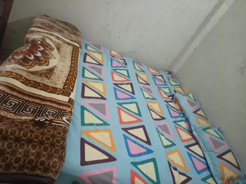 two pillows sitting next to each other in a room at Maruti Bhawan in Faizābād