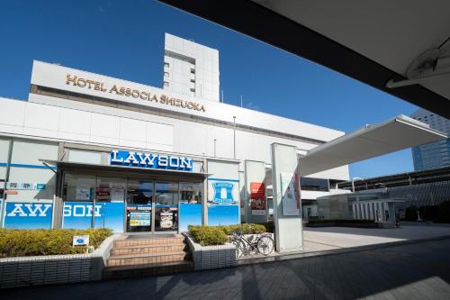 a large gas station in front of a building at Hotel Associa Shizuoka in Shizuoka