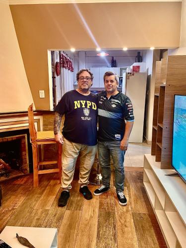 two men standing next to each other in a room at Manolo in Santa Rosa