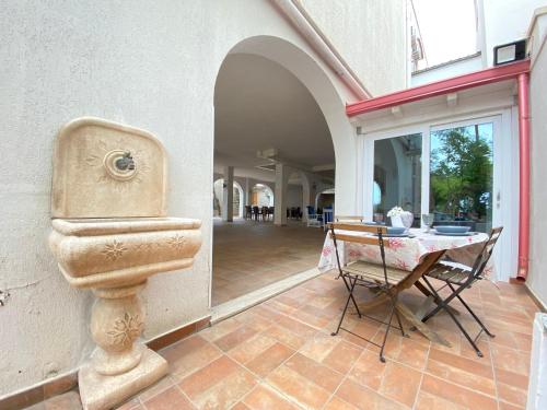 a bathroom with a toilet on the side of a building at Villa GAUDÌ in Sant'Isidoro