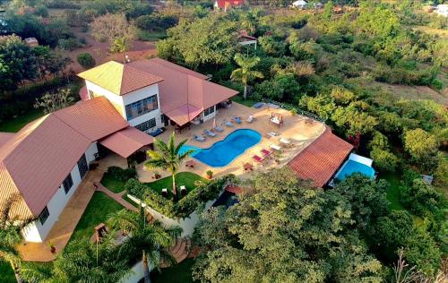 an aerial view of a house with a swimming pool at Pink Flamingo Boutique Hotel in Moshi