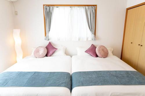 Nagashima Riverside House 4にあるベッド
