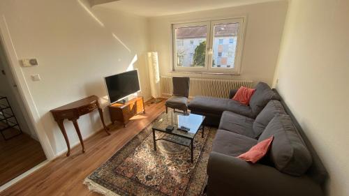 a living room with a couch and a table at gemütliche Wohnung in Bremen in Bremen