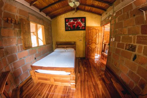 Postel nebo postele na pokoji v ubytování Hostal Vista Hermosa