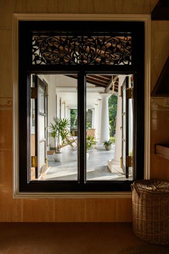 a view of a room through a window at Roots Retreat in Unawatuna