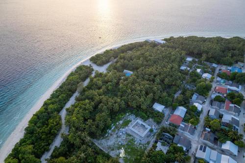 an aerial view of an island in the water at Dhonveli Hotel in Shaviyani Atoll