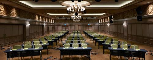 a large room with rows of tables and chairs at Royale Chulan Penang in George Town