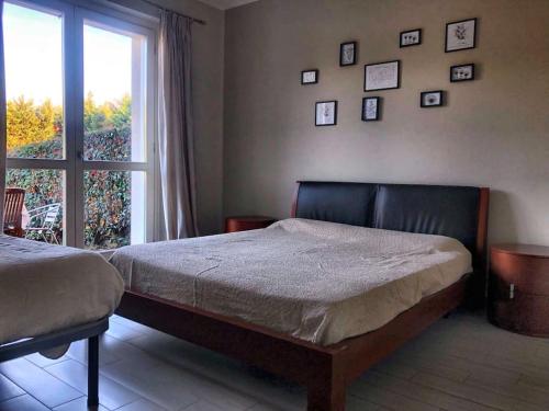 A bed or beds in a room at Casa - La Masca - Alla porta delle Langhe
