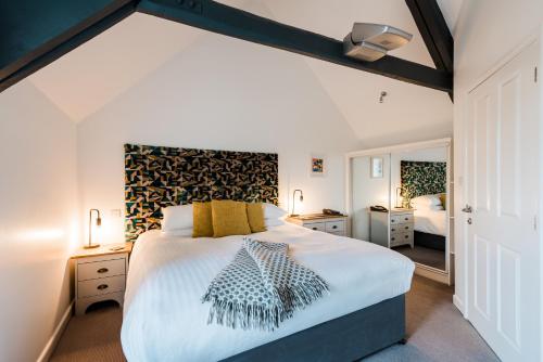 a bedroom with a large bed in a room at Mannings Hotel in Truro