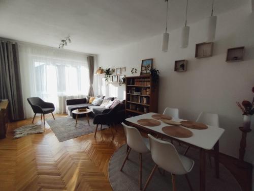 a living room with a table and chairs at Greenview Apartment in Budapest