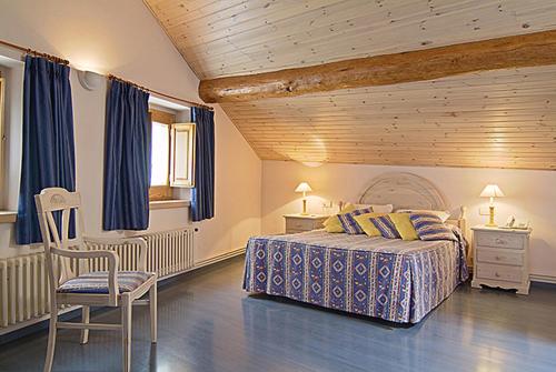 Postel nebo postele na pokoji v ubytování Hotel Jaume
