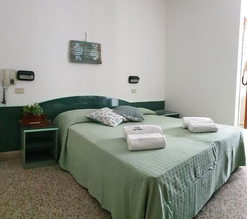 Postel nebo postele na pokoji v ubytování Hotel Concordia Palace