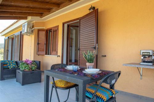a table and chairs sitting on a patio at Beth la Casa della Luna in Annunziata