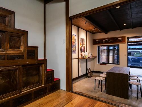 a dining room with a table and chairs at The　Nomad　Inn　Gujo in Gujo