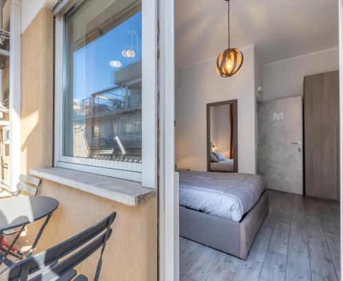 Postel nebo postele na pokoji v ubytování RomAntica Vatican Suites