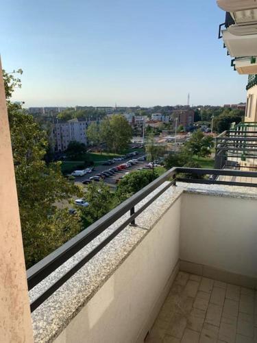 a balcony of a building with a view of a city at small panoramic flat in milan- one bedroom only in Milan