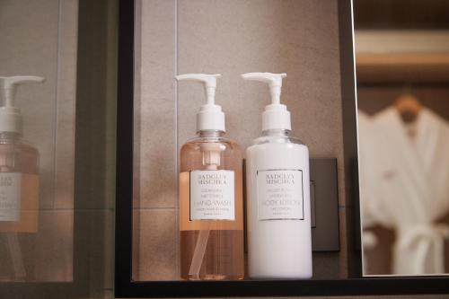 three bottles of soap in a display case at Citadines Connect Hari Busan in Busan