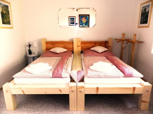a bedroom with two twin beds in a room at Penzion Bor in Náchod