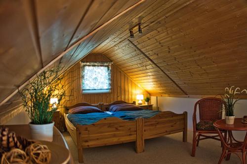 a bedroom with a wooden bed in a room at Useriner Ferienhaus in Userin