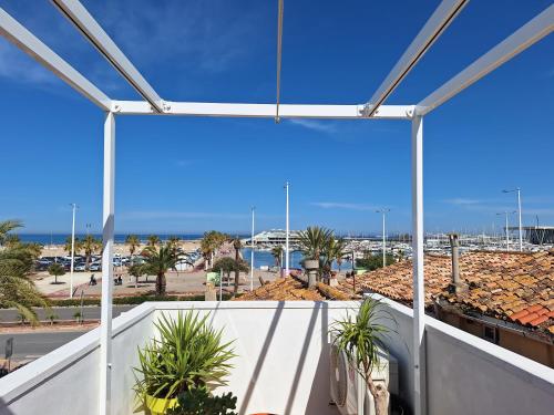 a view of the ocean from the balcony of a building at Casa Portet in Denia