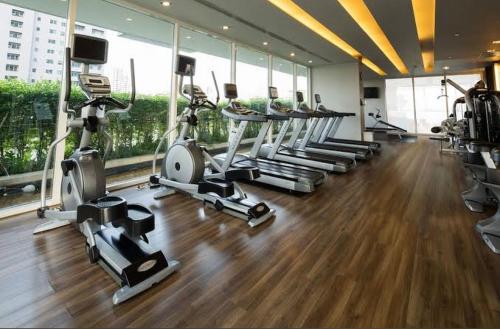 a gym with several treadmills and elliptical machines at Ivy Thonglor in Khlong Toei