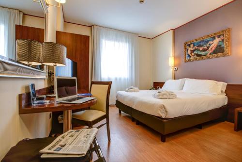 Postel nebo postele na pokoji v ubytování Hotel Europa