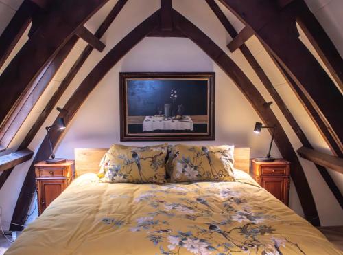 a bedroom with a bed in the attic at Keizersgracht Centre in Amsterdam