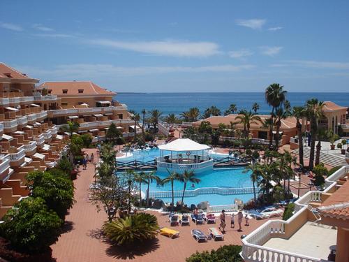 an aerial view of a resort with a swimming pool at Tenerife Royal Gardens - Las Vistas TRG - Viviendas Vacacionales in Playa de las Americas