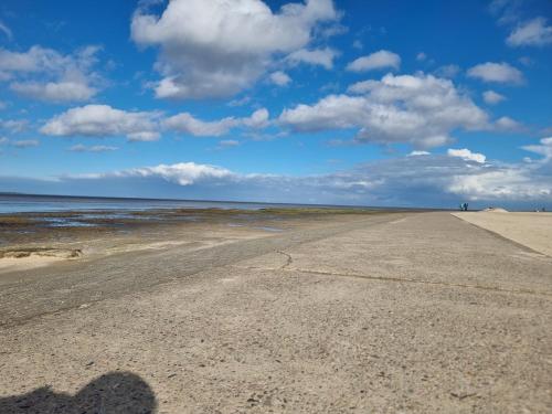 a shadow of a person on the beach at Nordseehaus Dangast in Dangast