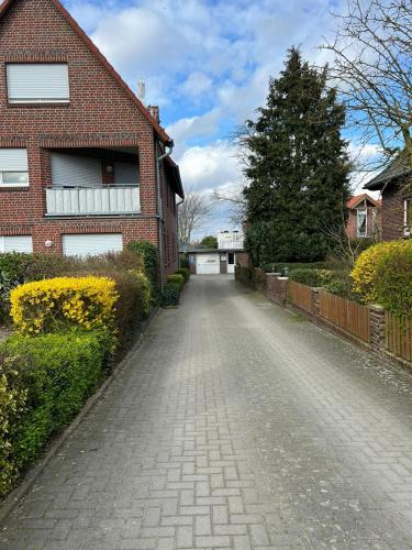 a brick road in front of a brick house at Nordseehaus Dangast in Dangast