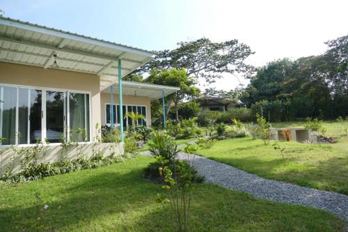 a garden in front of a house at Casitas Vista Verde in Bajo Boquete