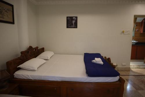 a bed with two white pillows on top of it at SWET APARAJITA in Bolpur