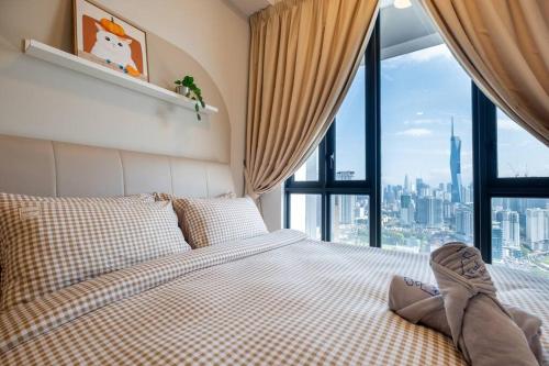 a bedroom with a bed and a large window at Cityscape KL Sentral@Sentral Suite-MRTLRTMonorail in Kuala Lumpur