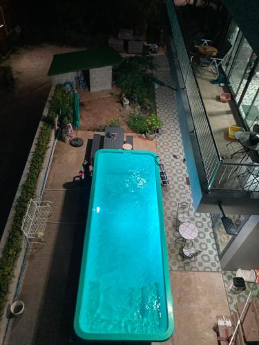 an overhead view of a swimming pool in a building at Seaview Eagles Nest Cabins in Rawai Beach