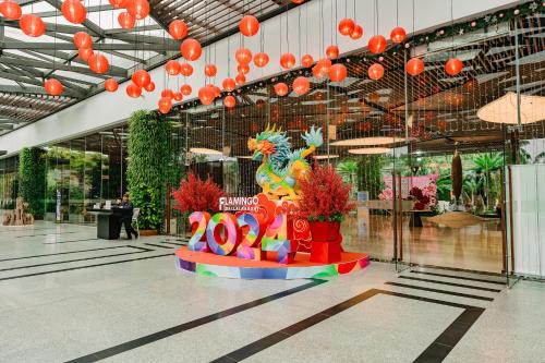 a lobby with a dragon statue in the middle of a building at Rosee Villa - Green Villa with private Pool in Vĩnh Phúc