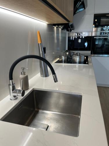 a kitchen counter with a sink and a sink at Luxury House - Puerto Rico in Puerto Rico de Gran Canaria