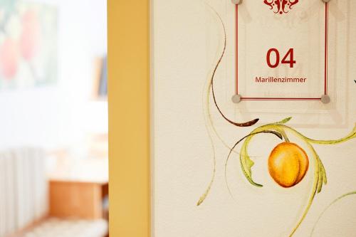 a picture of a painting of a mango on a wall at Donauhotel Lettnerhof in Au an der Donau