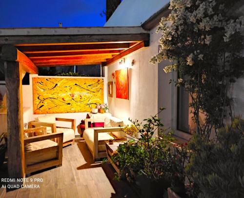 a living room with a couch and a table at B&B Domus de Janas Santa Teresa Gallura in Santa Teresa Gallura
