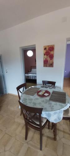 a table and a chair in a room at Giannis Stella apartment in Mourteri