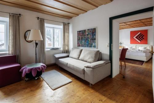 a living room with a couch and a table at Appartements Greier in Telfes im Stubai
