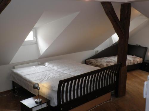 a bedroom with two beds in a attic at Apartment Paradise Michalská in Prague