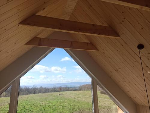 a view from the attic of a wooden roof at Zielone Wzgórze komfortowy klimatyzowany domek z balią z aeromasażem in Kłodzko
