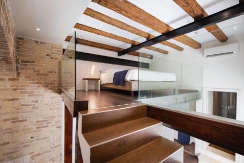 a room with a glass staircase and a bed at Azur Palace Luxury Rooms in Split